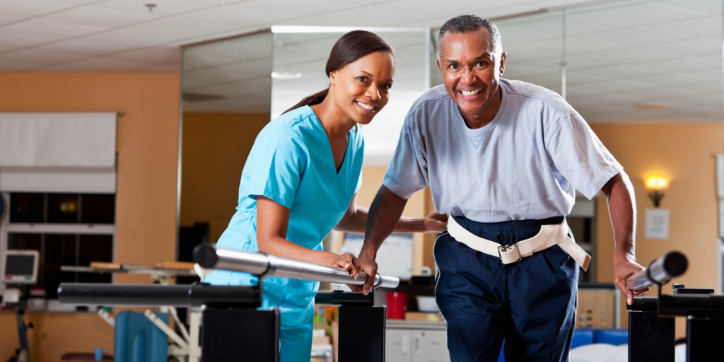 Physical therapist working with elderly man
